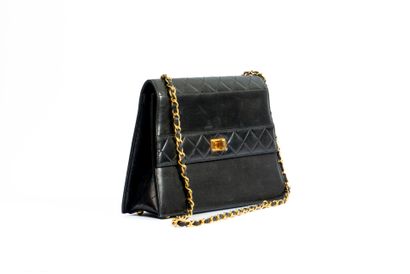 CHANEL
Trapezoid-shaped flap bag in partially...