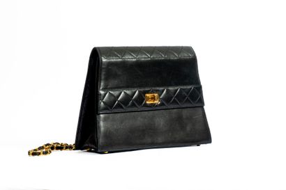 CHANEL
Trapezoid-shaped flap bag in partially...