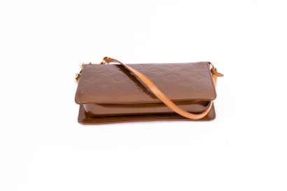 LOUIS VUITTON
Embossed leather accessory...