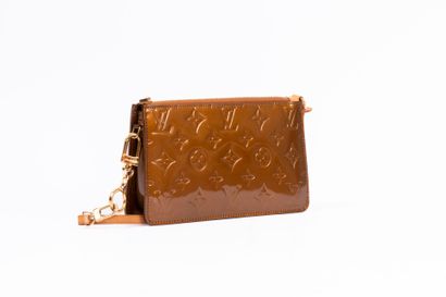 LOUIS VUITTON
Embossed leather accessory...