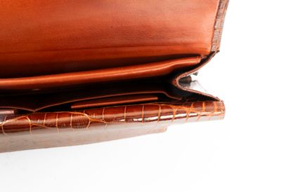 HERMES Paris. 
Brown crocodile clutch bag...