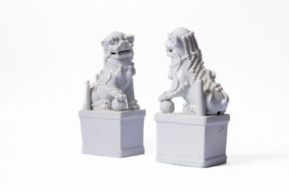 CHINA, 20th century
Pair of white enameled...