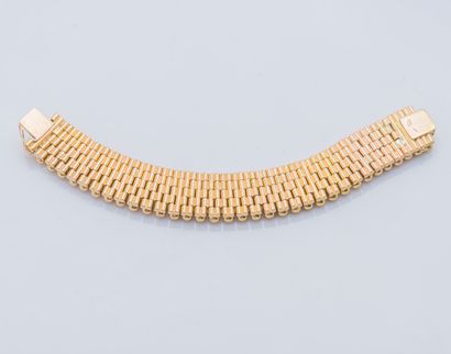 Bracelet ruban articulé en or jaune 18 carats...