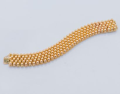 Bracelet ruban articulé en or jaune 18 carats...
