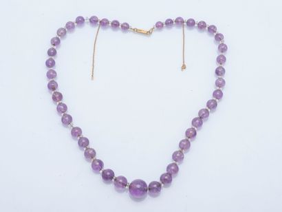 Necklace of falling amethyst beads alternating...