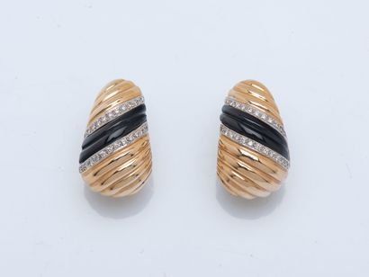 Pair of large oblong creoles in 14K yellow...