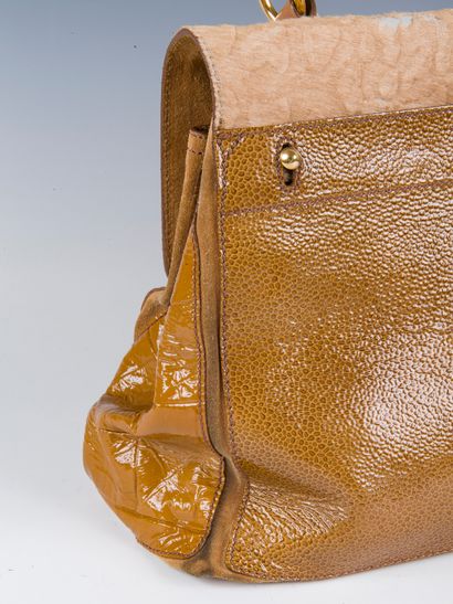 YVES SAINT LAURENT, 2008
Muse two bag in...