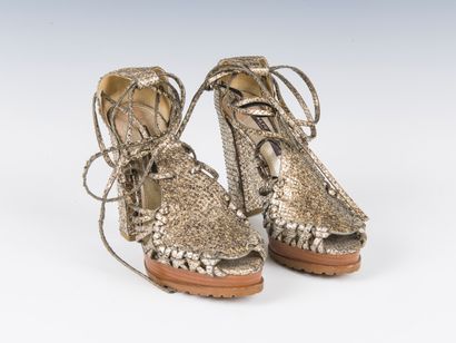 RALPH LAUREN
Pair of gold-tone python lace-up...