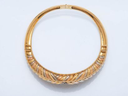Three-part articulated torque necklace adorned...