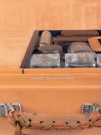 A. HARDY
Beige leather travel trunk comprising...