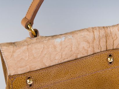 YVES SAINT LAURENT, 2008
Muse two bag in...