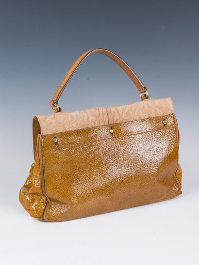 YVES SAINT LAURENT, 2008
Muse two bag in...