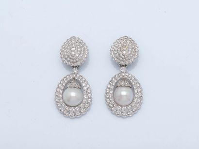 Pair of 18K (750 ‰) white gold earrings,...