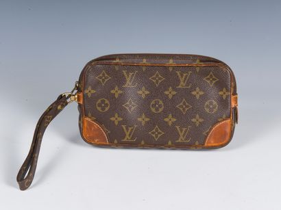 LOUIS VUITTON
Travel case with strap in Monogram...