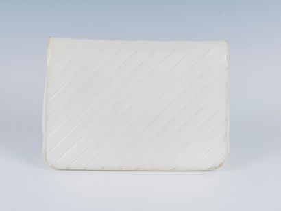 CHANEL
Quilted white lambskin bag, snap closure...