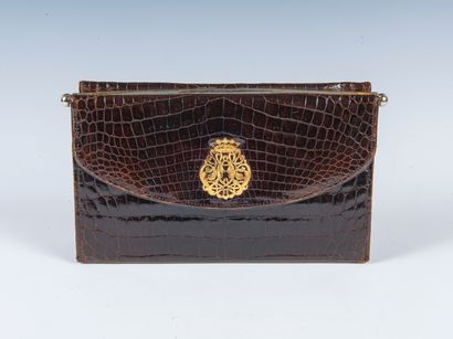 DUC
Stiff bag in chocolate crocodile leather...