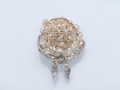 Bouquet brooch tied with a platinum ribbon...