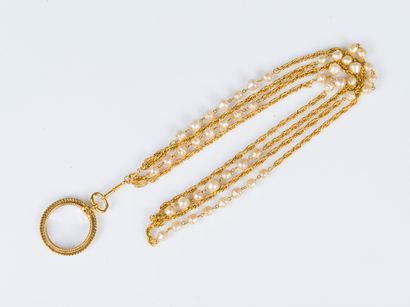 CHANEL, 1984
Gilded metal long necklace made...