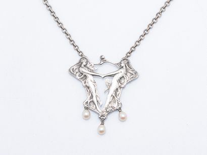 Metal pectoral necklace featuring a pendant...