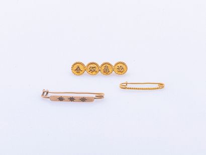 Set of three 18K yellow gold (750 ‰) barrettes...