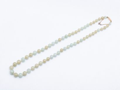 Necklace of falling celadon-hued jade beads,...