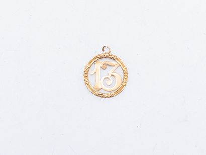 Round openwork pendant in 18K yellow gold...