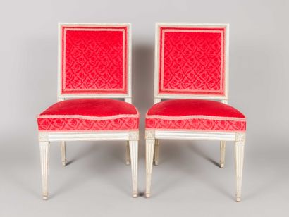 Pair of carved, white lacquered wood chairs...