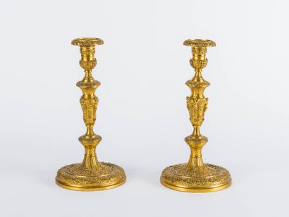 Pair of ormolu torches decorated with lambrequins...