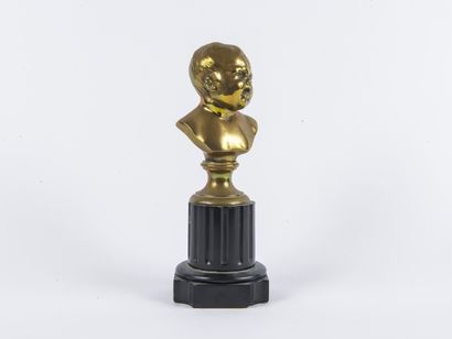 Buste d'enfant en bronze doré sur un piédouche...