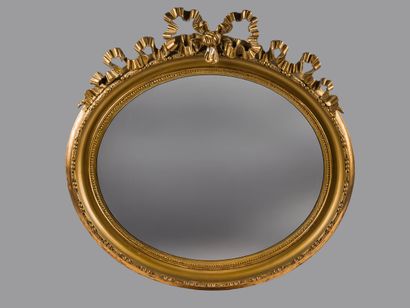 Set of two mirrors: 

Oval mirror in carved...