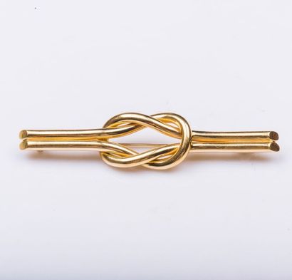 Broche barrette formant un n?ud en or jaune...