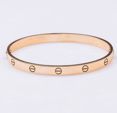 CARTIER
Bracelet Love formant un jonc rigide...