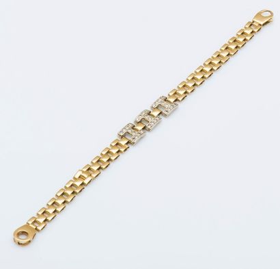 Bracelet à maillons articulés plat en or...
