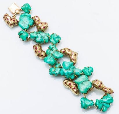 Large bracelet articulé en or jaune 14 carats...