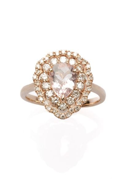 18K rose gold ring set with a pear-shaped...