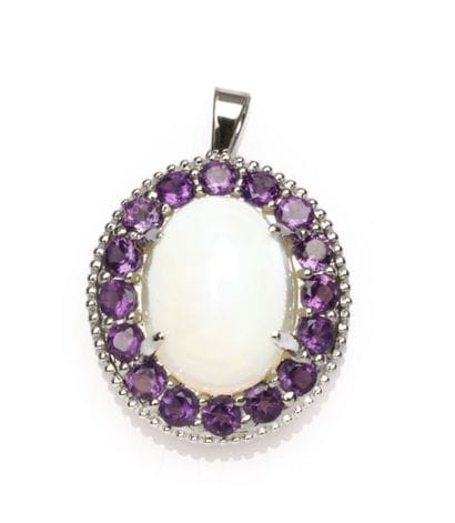 18K white gold pendant adorned with a cabochon-cut...