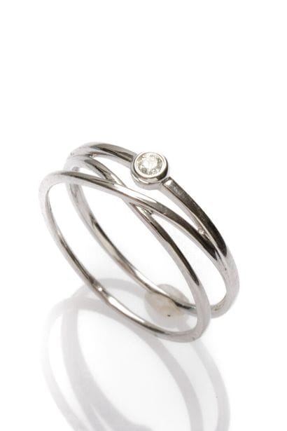 White gold design ring, set with a small...