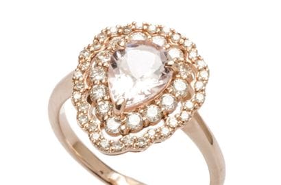 18K rose gold ring set with a pear-shaped...