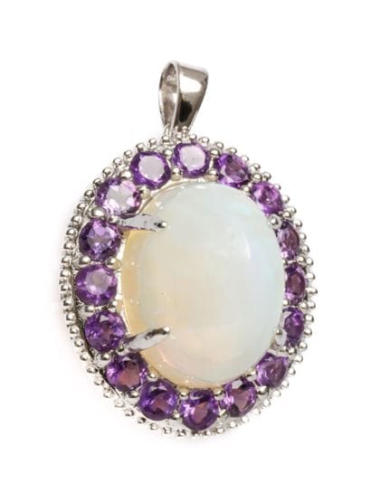 18K white gold pendant adorned with a cabochon-cut...