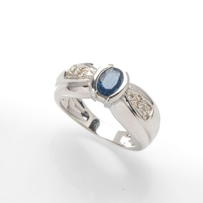 750 thousandths (18k) white gold ring featuring...