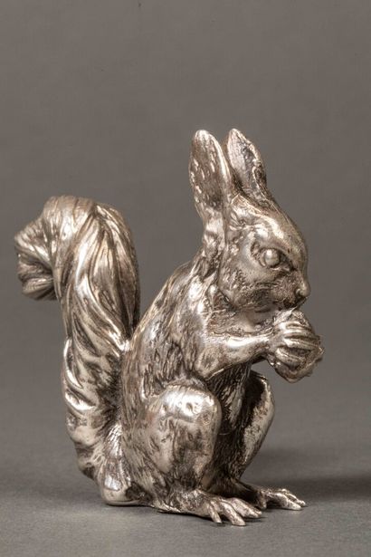 Silver squirrel holding a hazelnut.
Weight:...