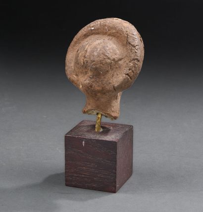 Roman period
Female head wearing a thick...