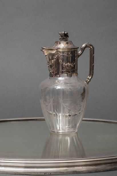 A cut-crystal ewer with silver mounting,...