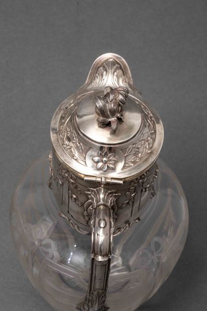 A cut-crystal ewer with silver mounting,...