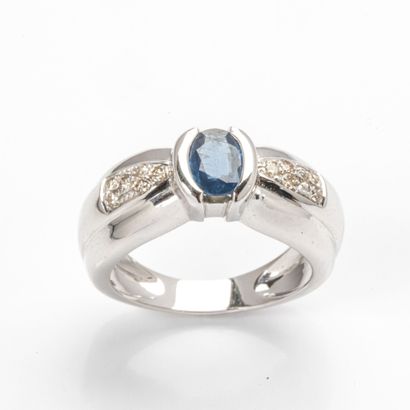 750 thousandths (18k) white gold ring featuring...