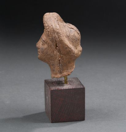 Roman period
Female head wearing a thick...