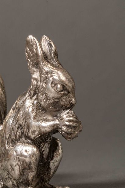 Silver squirrel holding a hazelnut.
Weight:...