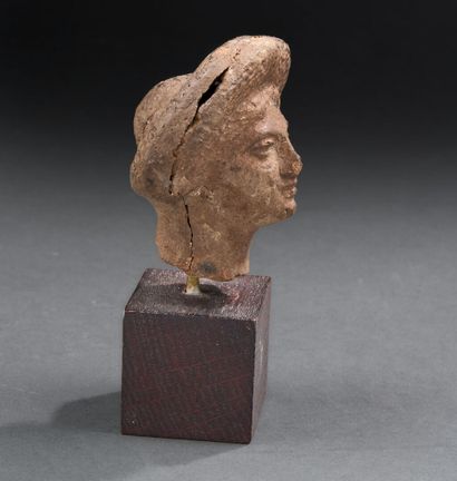 Roman period
Female head wearing a thick...