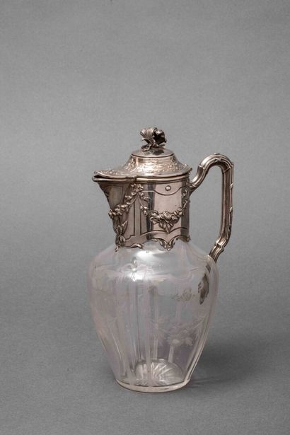 A cut-crystal ewer with silver mounting,...