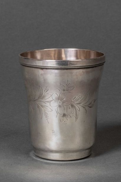 Silver 1st-title flared tumbler resting on...